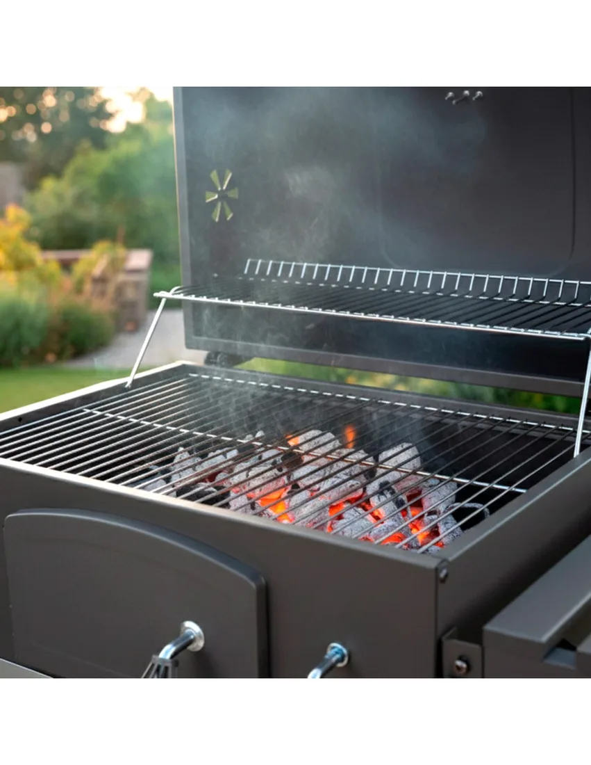 Barbacoa de carbón Aktive con ahumador y brasa regulable 102 cm: brasas encendidas bajo la parrilla